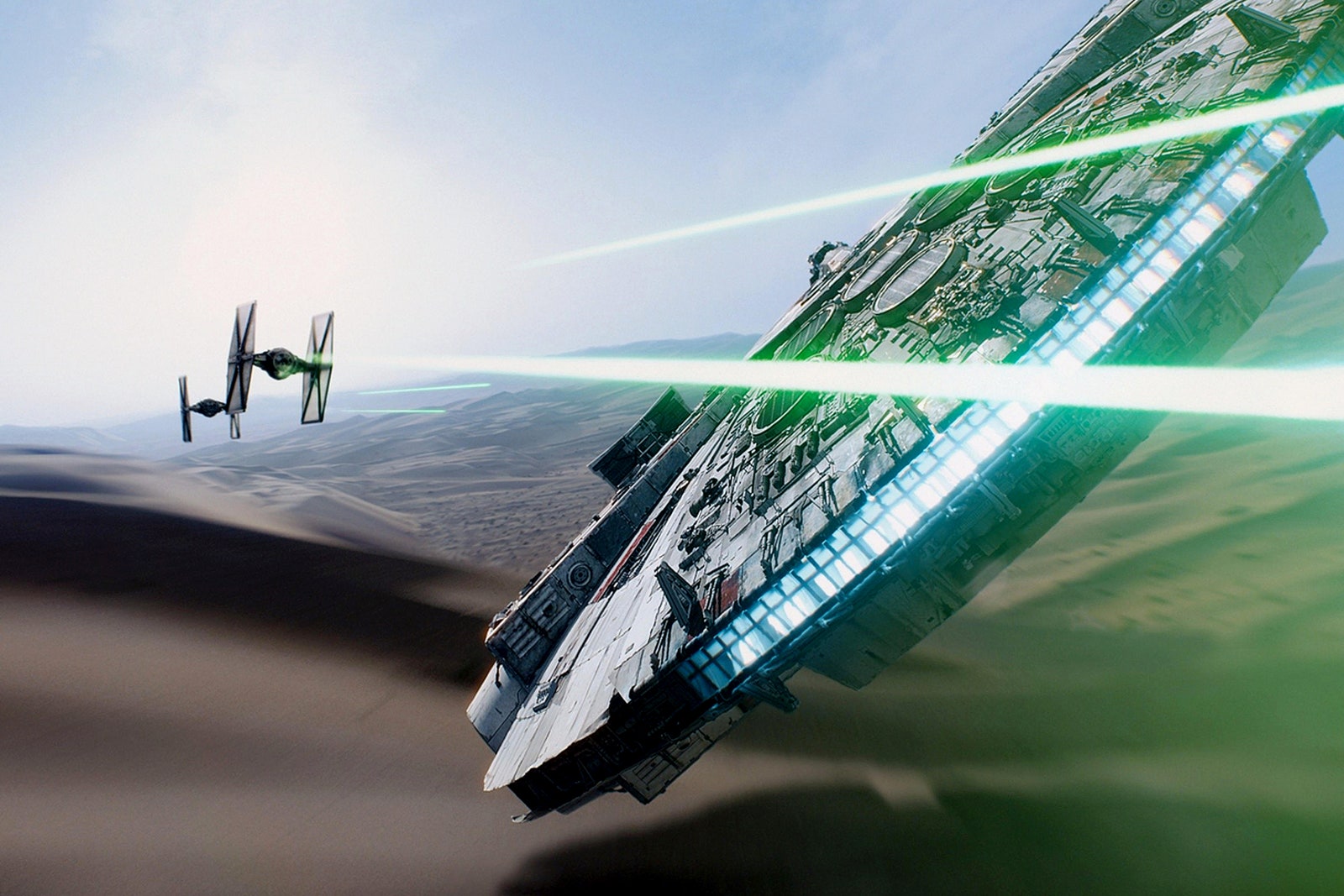 Still from STAR WARS THE FORCE AWAKENS featuring two spaceships flying and shooting lasers