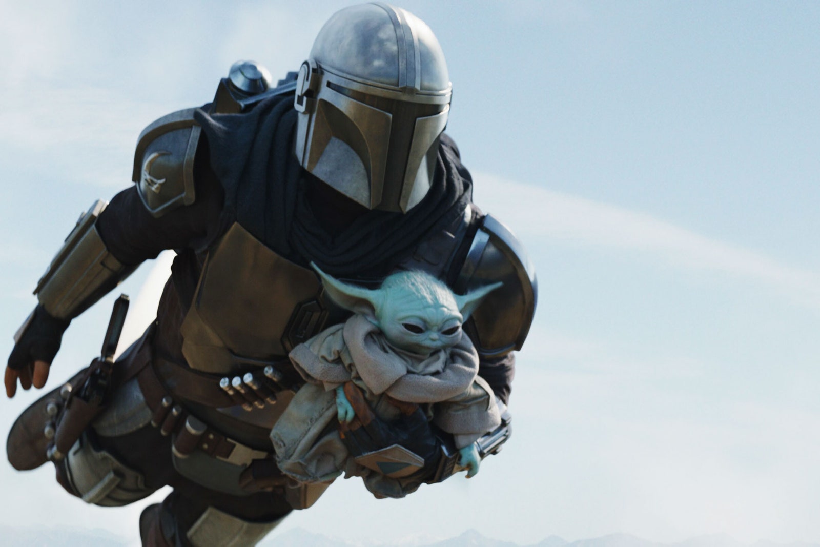 Mandalorian flying with baby Yoda